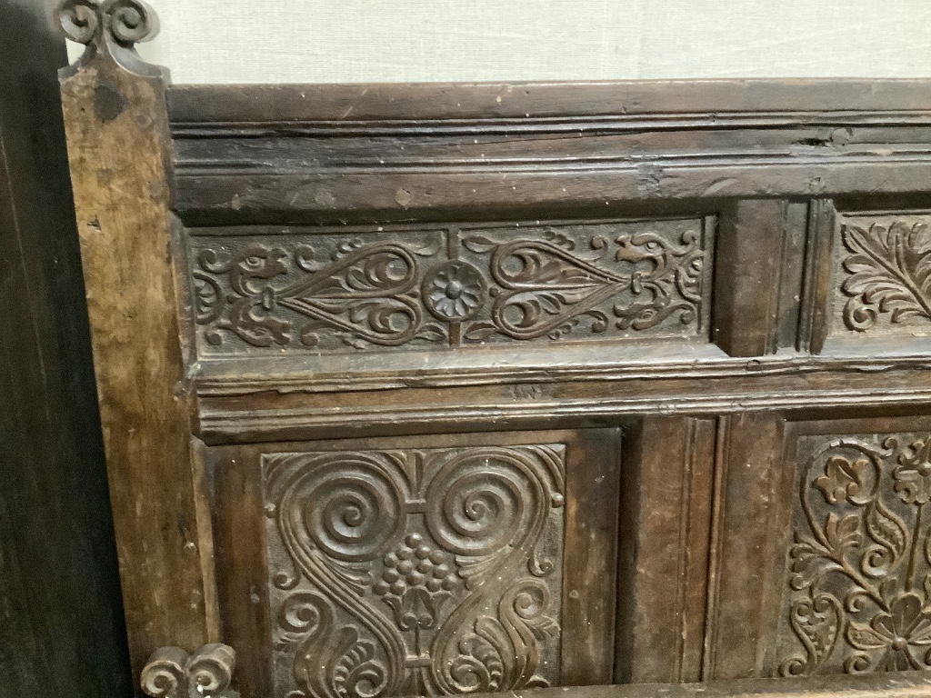 A carved oak double bedframe made from old timber, width 136cm height 139cm